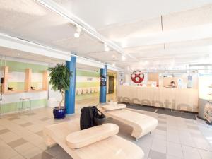 a lobby with two benches and a waiting room at Eurohostel in Helsinki