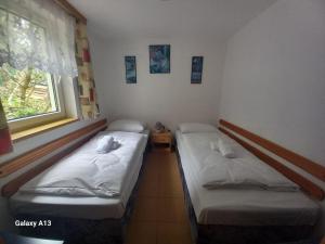 Postel nebo postele na pokoji v ubytování HOTEL RAJSKY