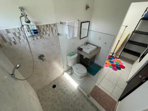 an overhead view of a bathroom with a shower and a toilet at Home's Jungle Puerto Morelos Cancun 20 Minutes from the Airport in Cancún