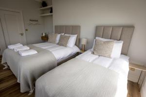 Letto o letti in una camera di Coastal View House