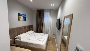 Postel nebo postele na pokoji v ubytování Villa Tramonto Vlore