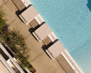 an overhead view of chairs and a pool of water at Apollo Plakias in Plakias