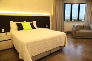 A bed or beds in a room at Loft moderno no coração de Barreiras
