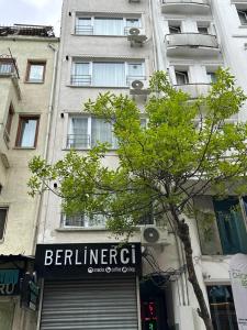 a building with a sign on the front of it at Alha apart otel in Istanbul