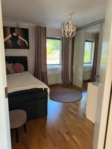 Ένα ή περισσότερα κρεβάτια σε δωμάτιο στο Harmoni Hideaway