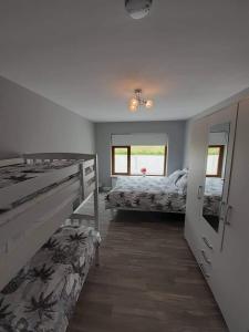 Postel nebo postele na pokoji v ubytování Tranmore Lodge