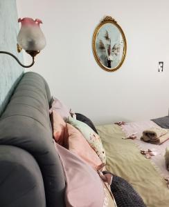 a bedroom with a bed with a lamp and a mirror at Mirka & Franck AIRCON Apartment Chic 4" Stars Parking Free, Garage & Wine with Avantages Pack in Colmar