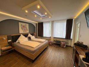 a bedroom with a bed in a room at Pension Zwei A in Leverkusen