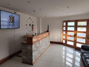 TV a/nebo společenská místnost v ubytování HOTEL QUINTA ESTACIÓN
