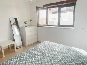 Ένα ή περισσότερα κρεβάτια σε δωμάτιο στο Casinha do Lagar