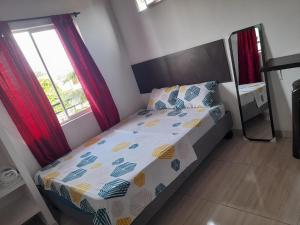 Postel nebo postele na pokoji v ubytování apartaestudios el jardin 2
