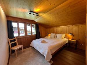 Postel nebo postele na pokoji v ubytování Chalet Diablerets