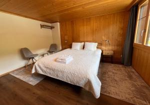 Ένα ή περισσότερα κρεβάτια σε δωμάτιο στο Chalet Diablerets