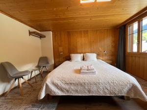 Ένα ή περισσότερα κρεβάτια σε δωμάτιο στο Chalet Diablerets
