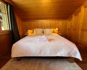 Ένα ή περισσότερα κρεβάτια σε δωμάτιο στο Chalet Diablerets