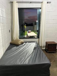 Ein Bett oder Betten in einem Zimmer der Unterkunft Espaço Mattigor