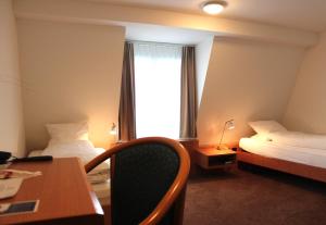 Giường trong phòng chung tại Hotel Freihof Swiss Lodge