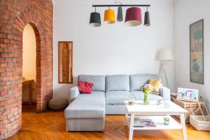 a living room with a couch and a table at Bricks & Bikes in Zagreb