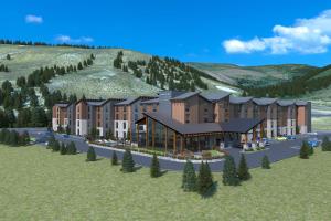 a rendering of a building with a mountain in the background at TownePlace Suites by Marriott Avon Vail Valley in Avon