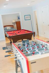 a room with a pool table with balls on it at Alaskan Sunset House - Ground Floor Unit in Anchorage