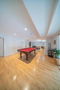 a large room with a pool table in it at Alaskan Sunset House - Ground Floor Unit in Anchorage