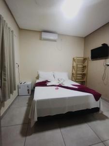 Cama ou camas em um quarto em Pousada Vista da Serra - Suzart