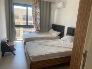 Postel nebo postele na pokoji v ubytování Marassi hotel Apartment