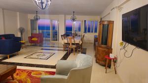 A television and/or entertainment centre at Alex sea view apartment - families only