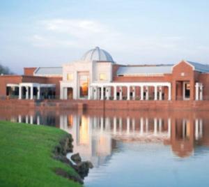 a building sitting next to a body of water at Southern Luxury Eastchase District 3br and 2bth in Mitylene