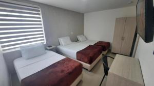 Voodi või voodid majutusasutuse Bayit Tov Circunvalar Hotel toas