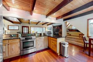a large kitchen with wooden floors and wooden ceilings at Mountain Escape in South Lake Tahoe