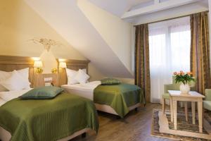 Postel nebo postele na pokoji v ubytování Hotel Rebstock