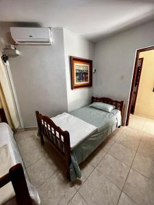Ένα ή περισσότερα κρεβάτια σε δωμάτιο στο Carolina's Hostel