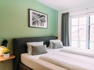 Ein Bett oder Betten in einem Zimmer der Unterkunft Tauern Lodge L