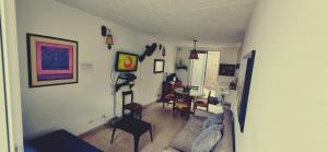 Posezení v ubytování Casa descanso en Anapoima Conjunto con piscina 3 habitaciones