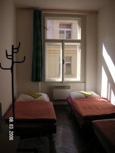 Postel nebo postele na pokoji v ubytování Hostel Bell