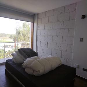Ένα ή περισσότερα κρεβάτια σε δωμάτιο στο Villa Rodríguez-Peña