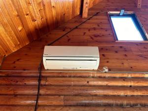 an overhead view of an appliance on a wooden floor at Tokashiki Guest House in Tokashiki