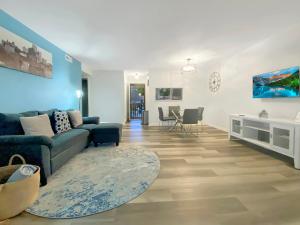 a living room with a couch and a table at Prime location! Upscale, spacious 2BR-2 full BA Condo in Winston-Salem