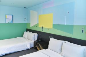 Postel nebo postele na pokoji v ubytování Hotel Cappuccino