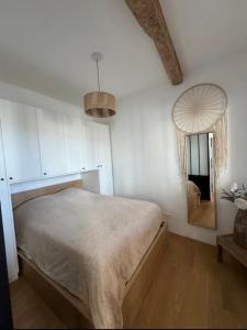 Ένα ή περισσότερα κρεβάτια σε δωμάτιο στο Appartement Cosy
