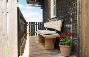 a bench on the porch of a house at Ferienhaus In Eibiswald in Eibiswald