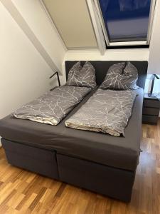 En eller flere senge i et værelse på Danube Rooftop Apartment 15