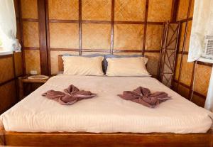 Postel nebo postele na pokoji v ubytování Abihon HoferHaus Mactan Guesthouse