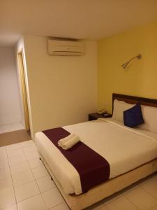 Postel nebo postele na pokoji v ubytování Syajie Koptown Hotel