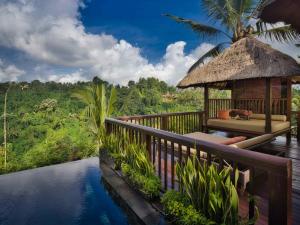 a resort with a pool and a gazebo at Hanging Gardens of Bali in Payangan