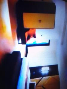 En TV eller et underholdningssystem på Villa toscana luxe hotel port Harcourt
