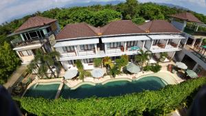 an aerial view of a mansion with a swimming pool at De Padma Gili Air in Gili Islands