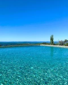 an island in the middle of a large body of water at Villa dos Pireneus in Pirenópolis