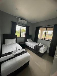 Postel nebo postele na pokoji v ubytování Prasad Apartments